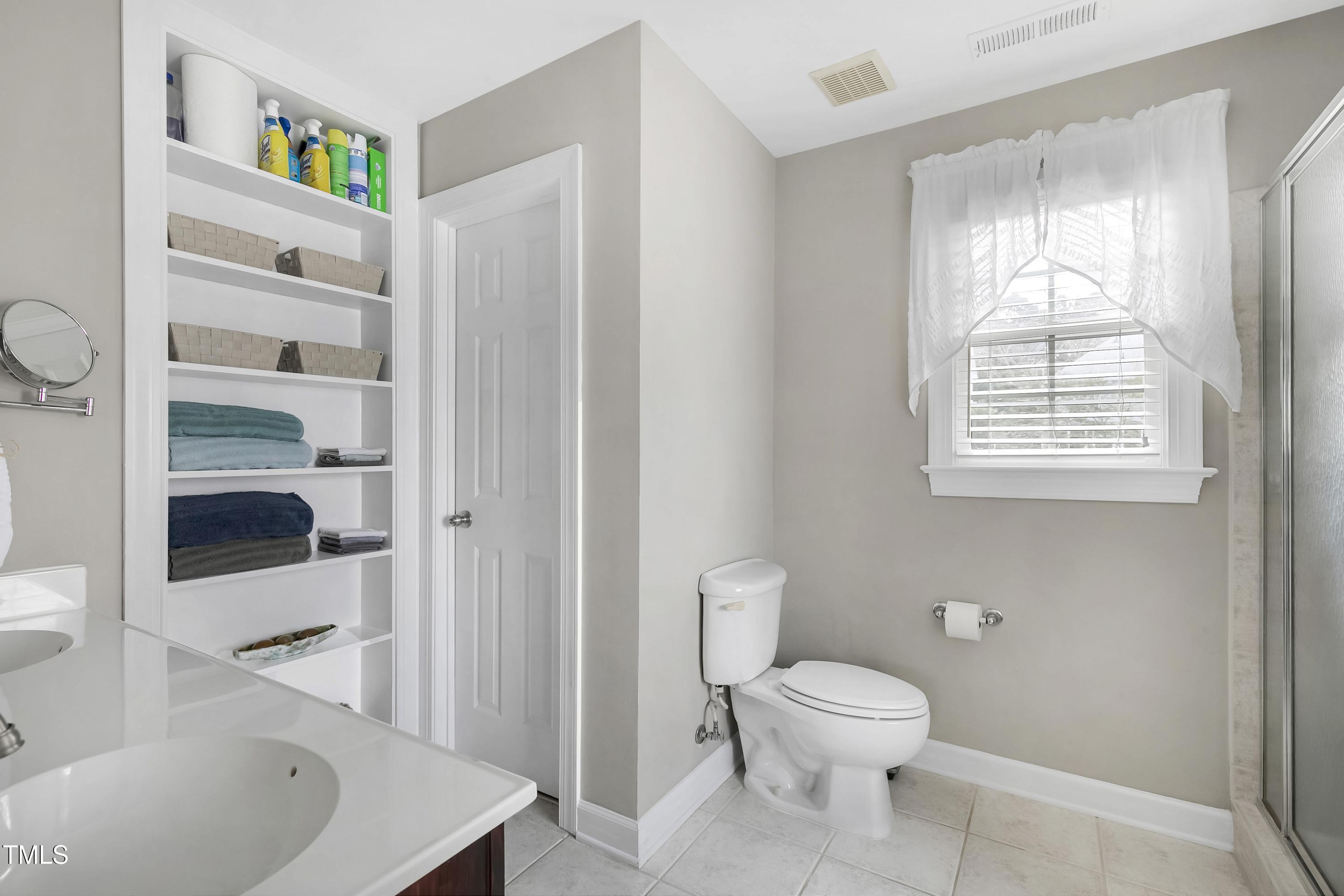 102 Kenneil Court Apex, NC 27502 - Photo 23 of 55 a bathroom with a toilet a sink and a bathtub