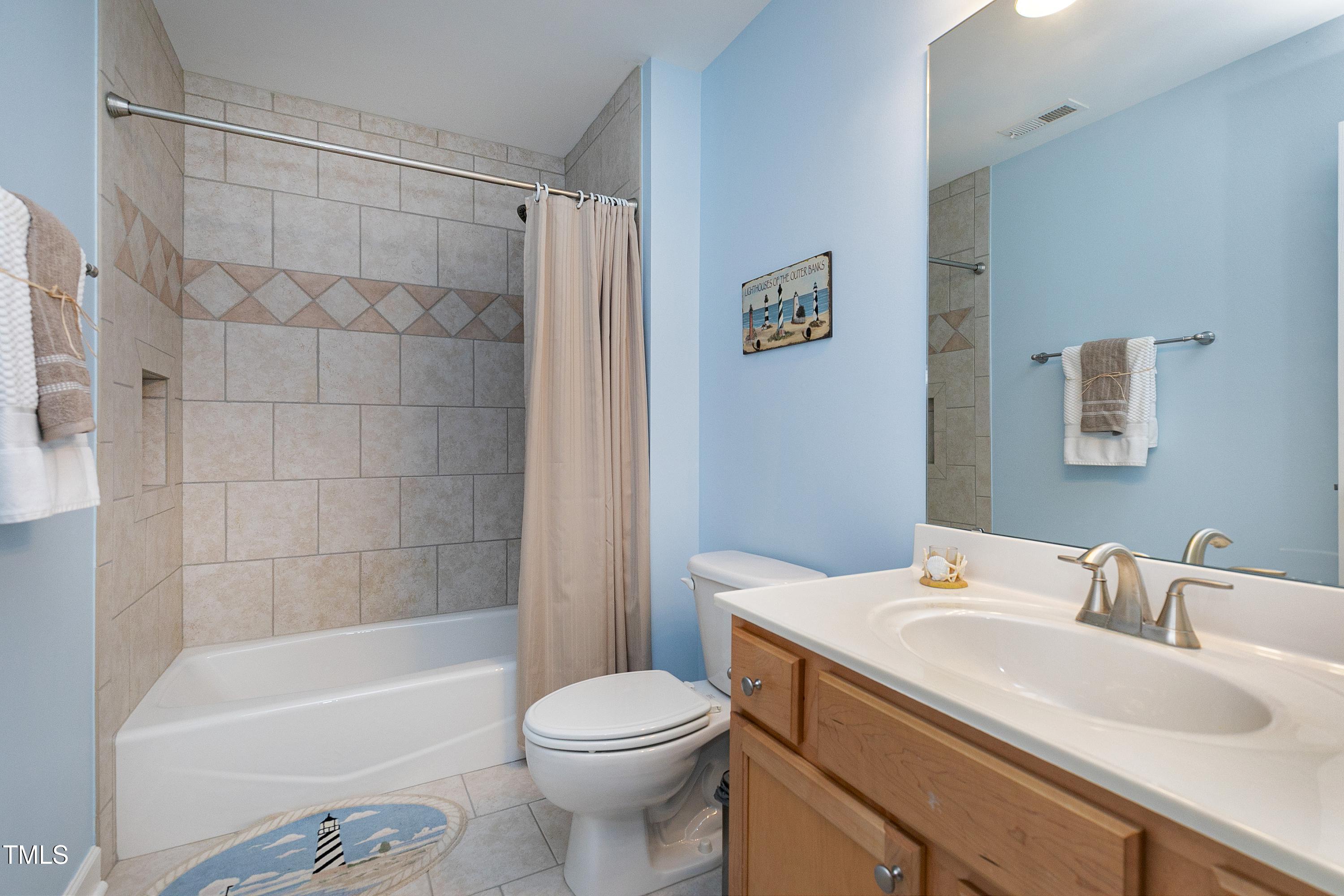 102 Kenneil Court Apex, NC 27502 - Photo 29 of 55 a bathroom with a sink toilet and shower