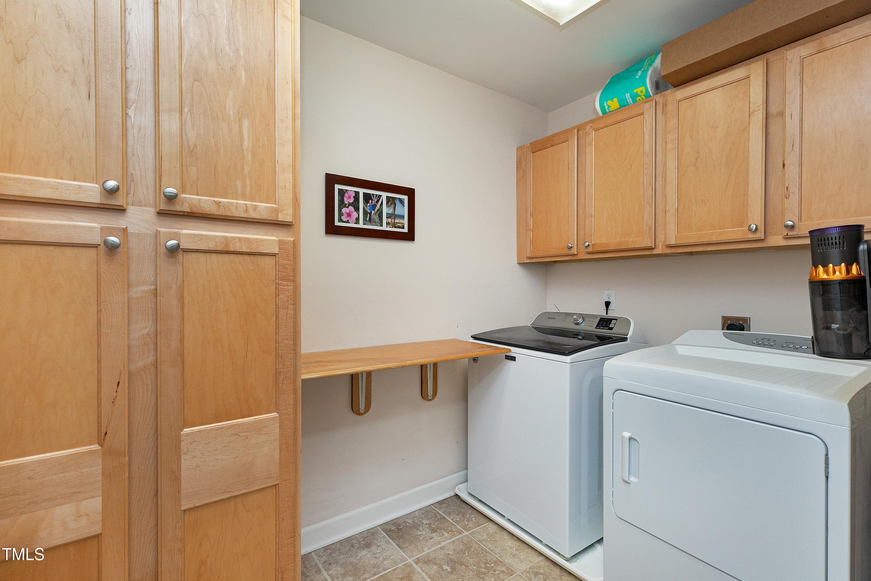 102 Kenneil Court Apex, NC 27502 - Photo 34 of 55 a utility room with dryer and washer