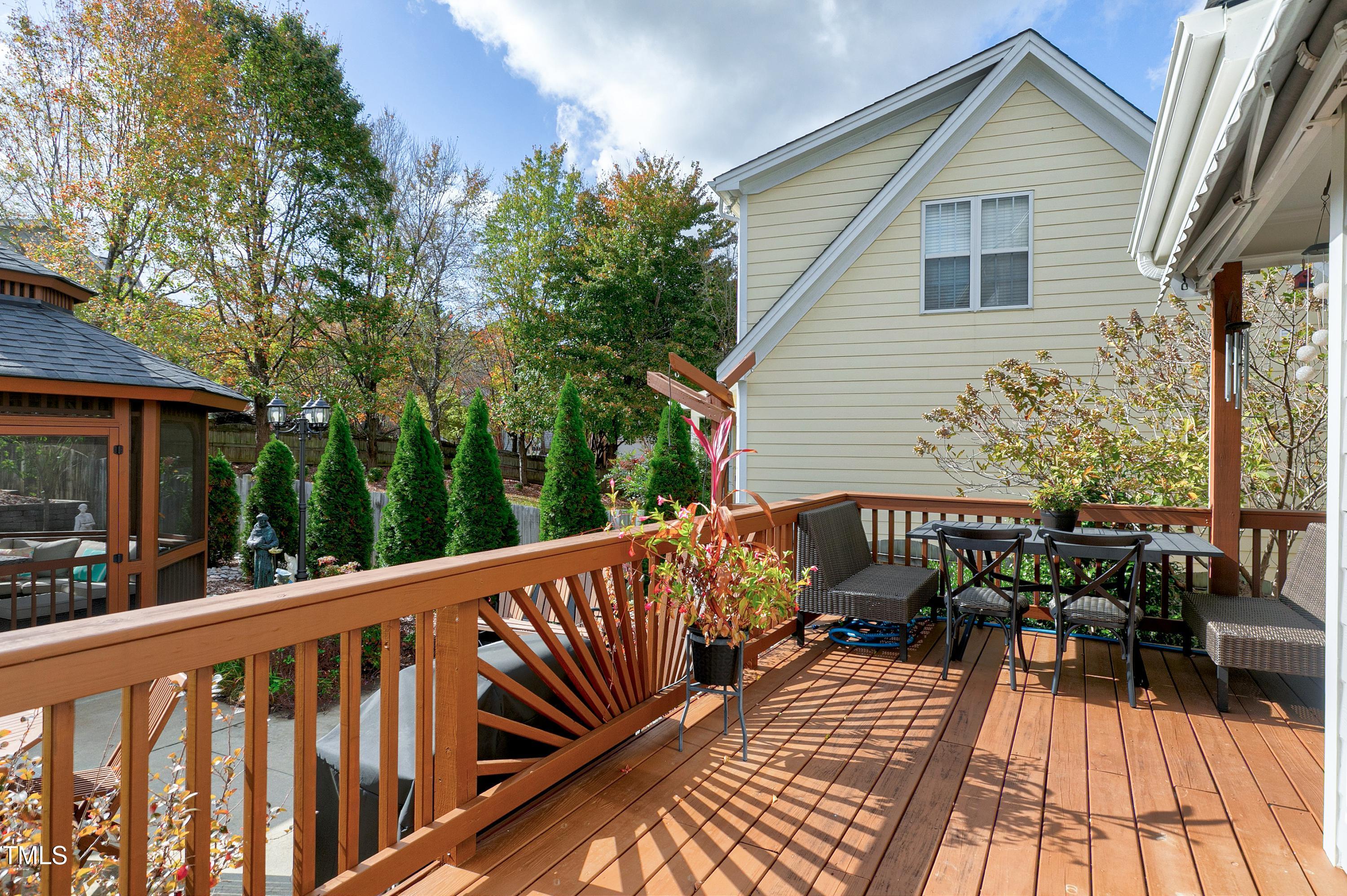 102 Kenneil Court Apex, NC 27502 - Photo 37 of 55 a view of a wooden deck with chairs