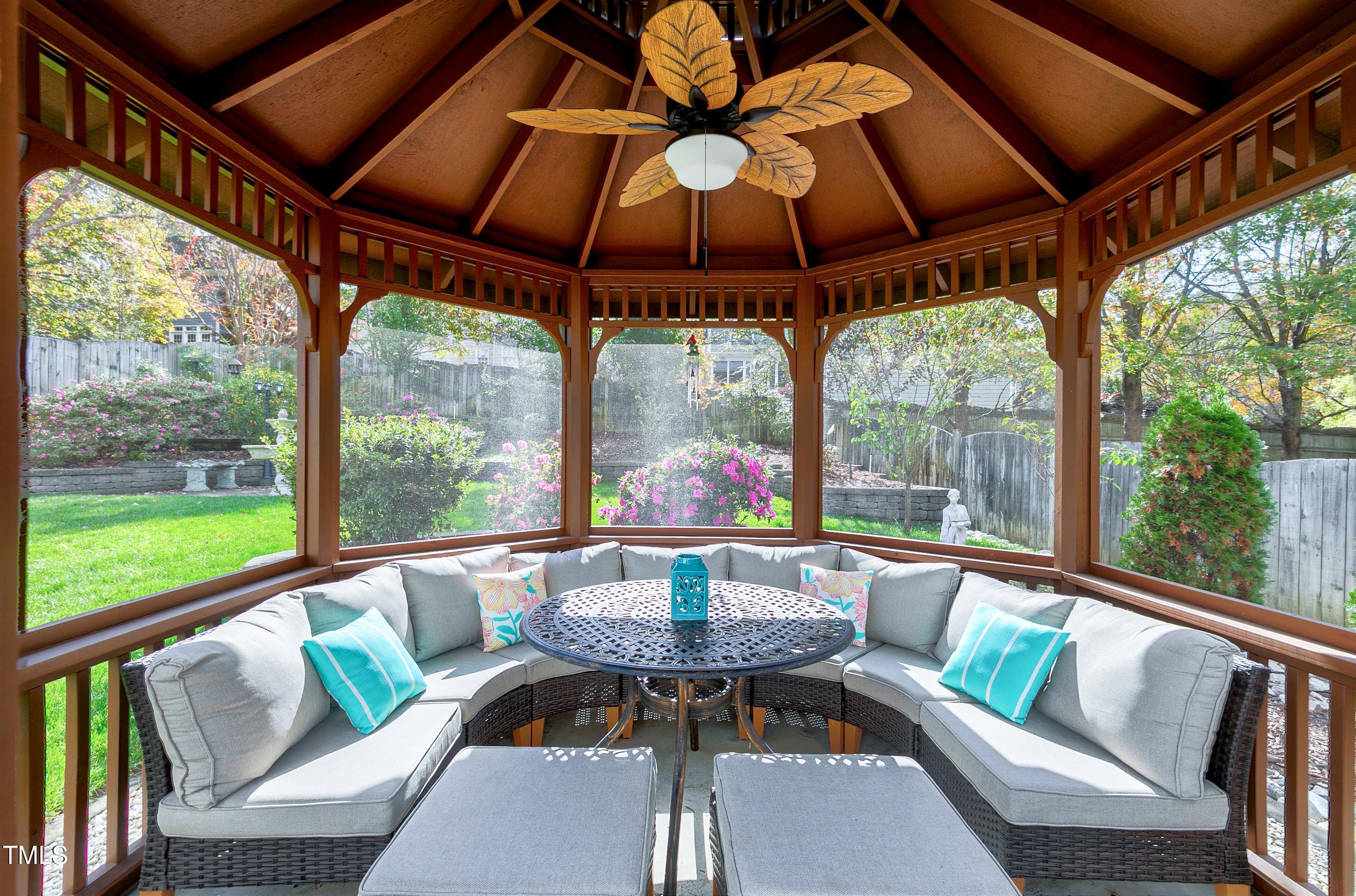 102 Kenneil Court Apex, NC 27502 - Photo 41 of 55 a view of a patio with a table chairs and a table