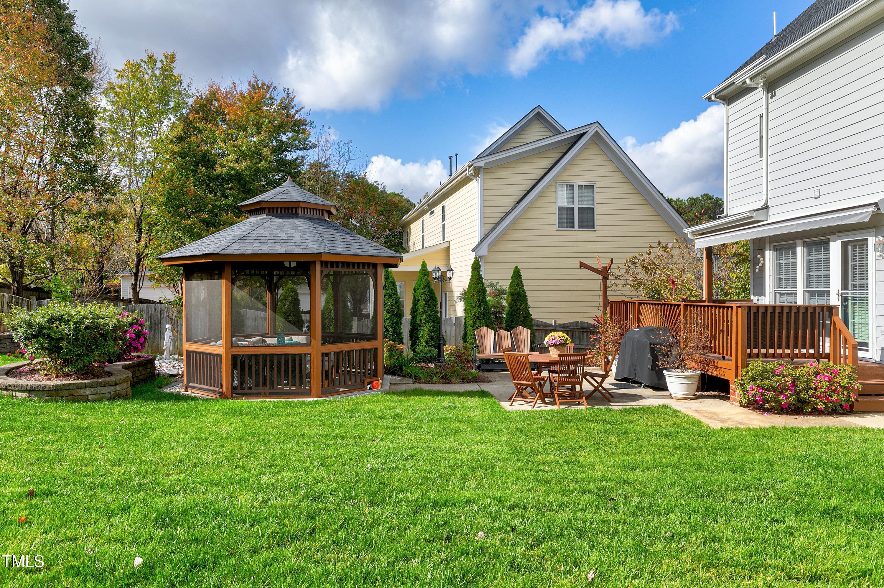 102 Kenneil Court Apex, NC 27502 - Photo 42 of 55 a front view of a house with garden