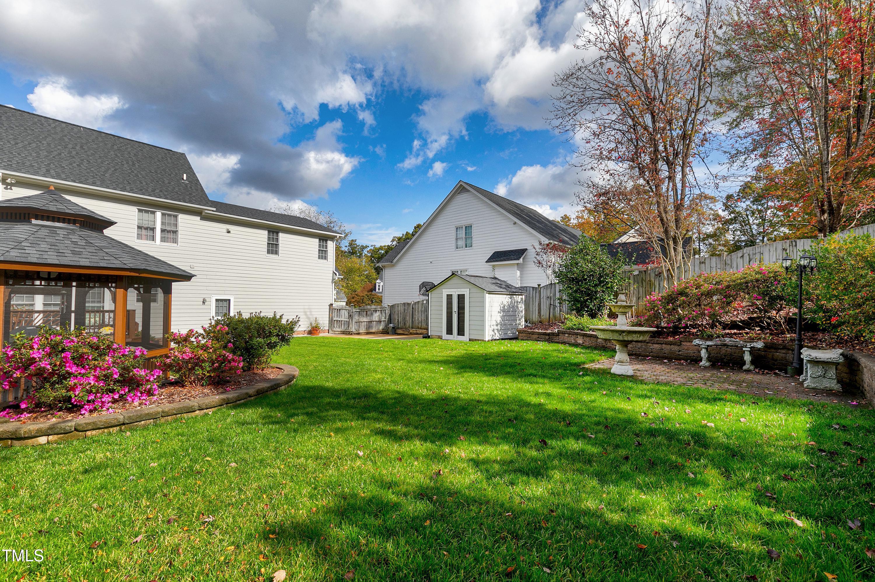 102 Kenneil Court Apex, NC 27502 - Photo 45 of 55 a view of a house with a back yard