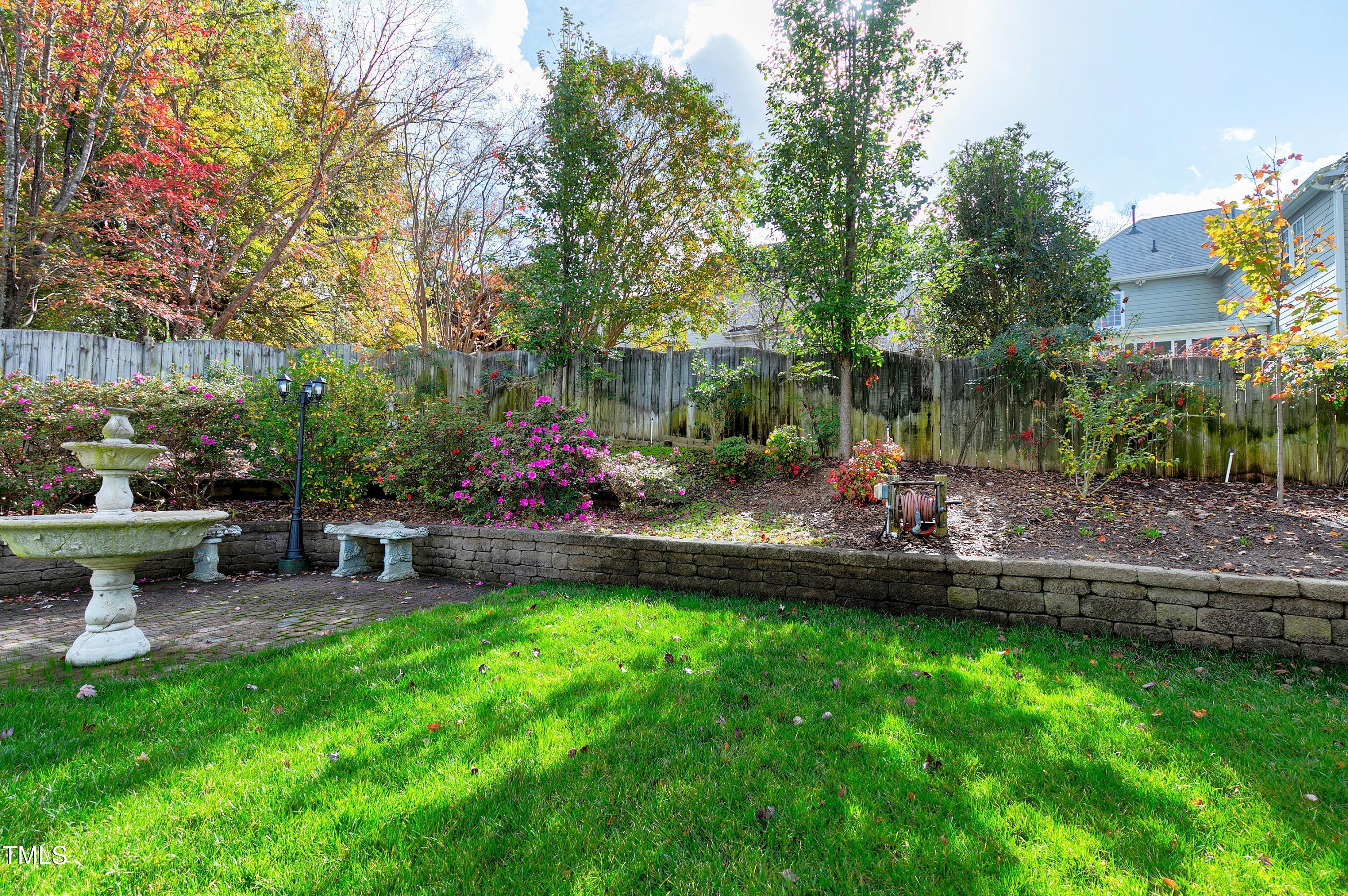 102 Kenneil Court Apex, NC 27502 - Photo 48 of 55 a view of a backyard and sitting area