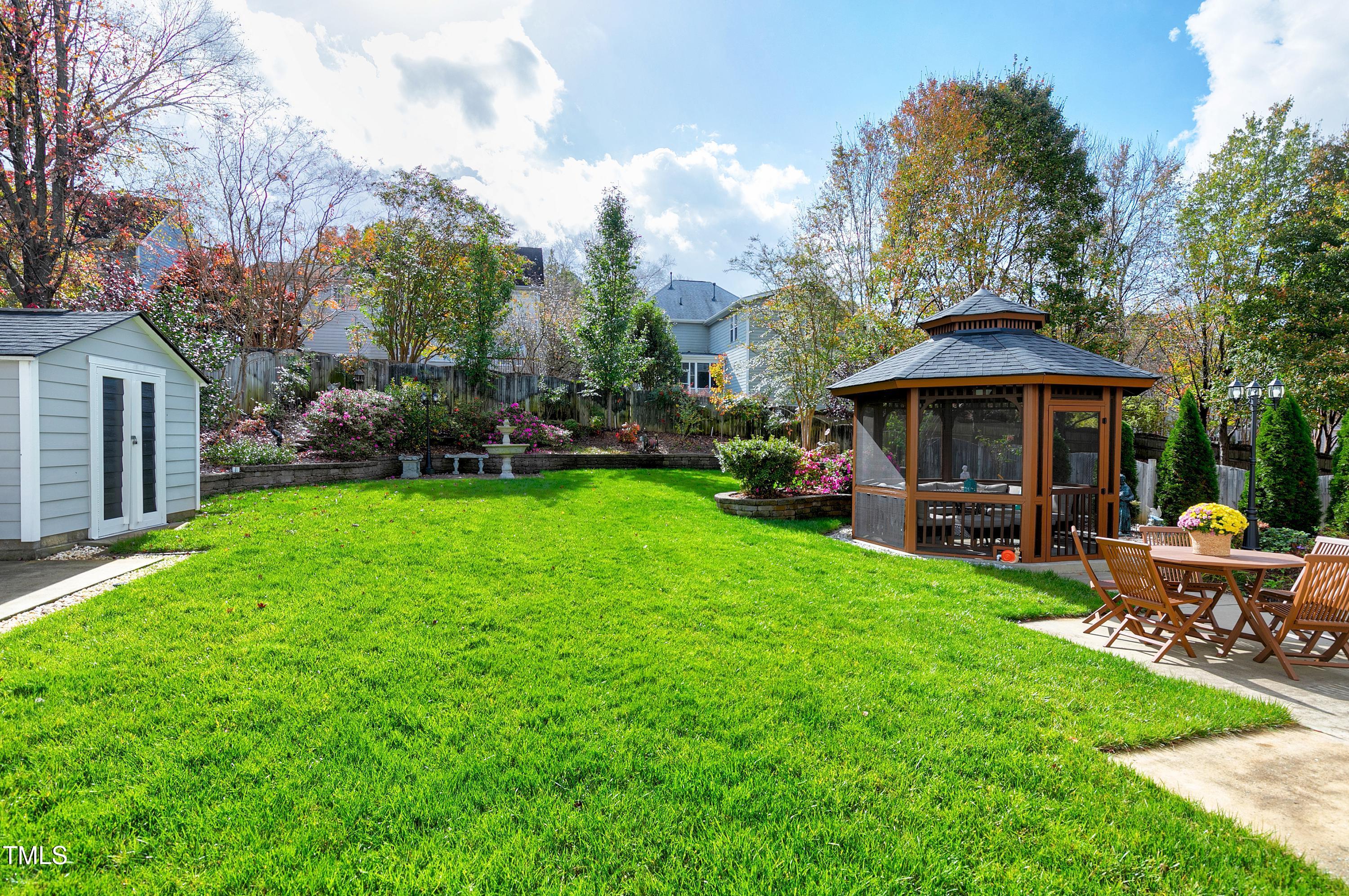 102 Kenneil Court Apex, NC 27502 - Photo 50 of 55 a view of a house with a yard porch and sitting area