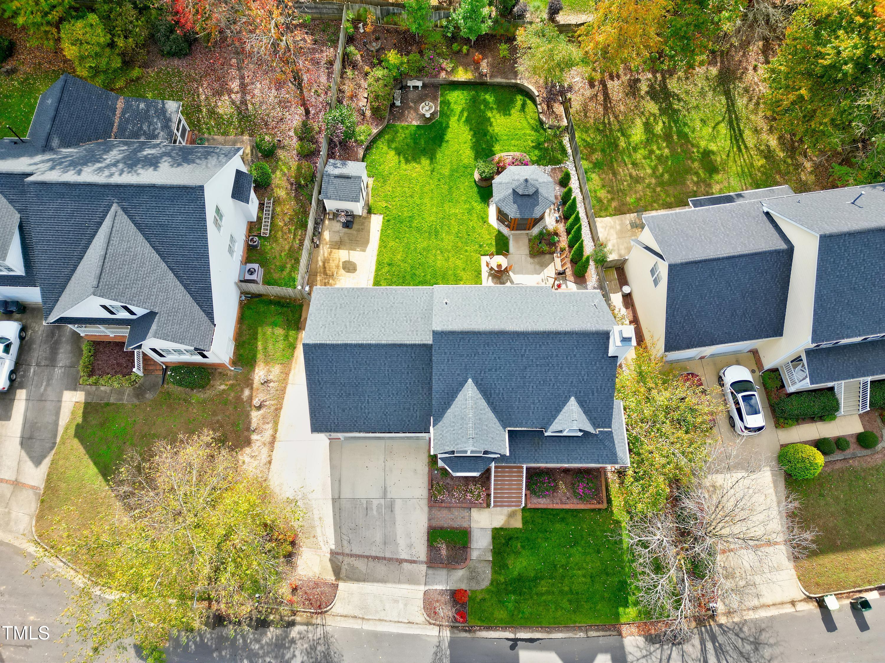 102 Kenneil Court Apex, NC 27502 - Photo 52 of 55 an aerial view of a house with a garden and trees