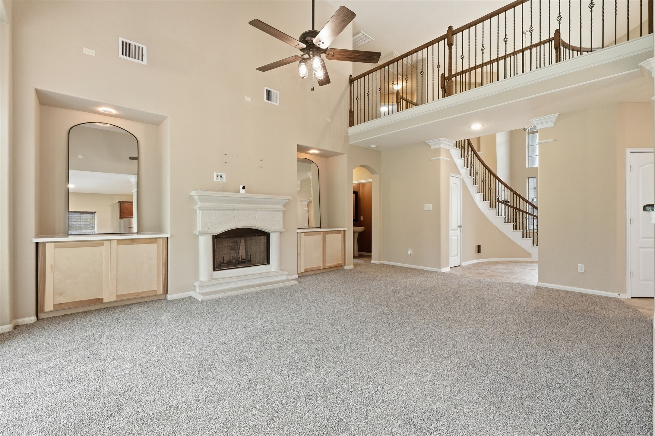 12410 Adams Ridge Lane Humble, TX 77346 - Photo 8 of 33 The upstairs looks down into the living room.