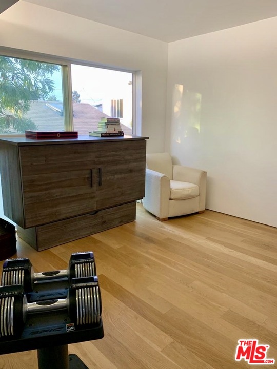 338 Rennie Avenue, Unit 2 Venice, CA 90291 - Photo 17 of 21 a living room with furniture and a floor to ceiling window