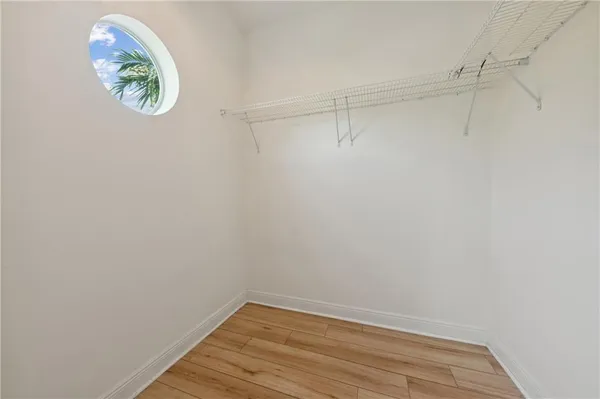 a view of a small space with racks on the wall