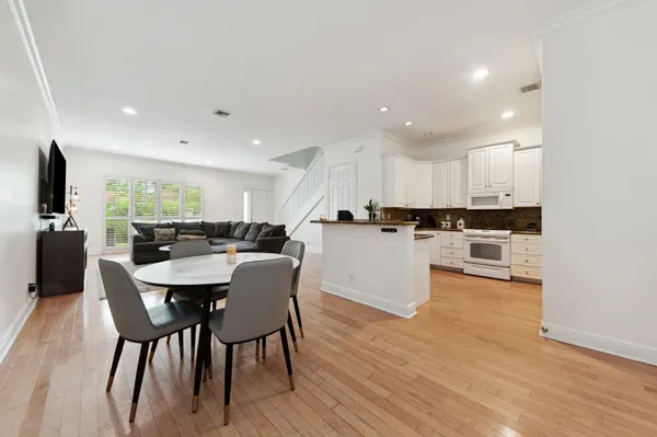 a kitchen with a table and chairs in it