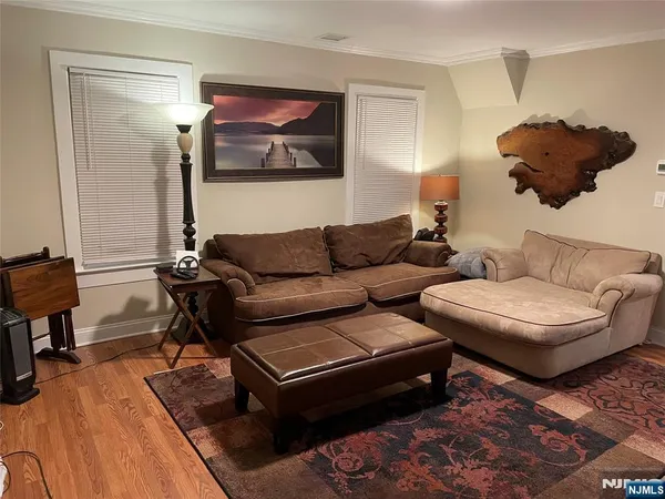 a living room with furniture and a lamp
