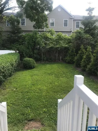a house view with a garden space