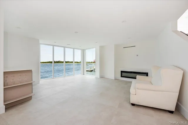 a view of an empty room with glass door