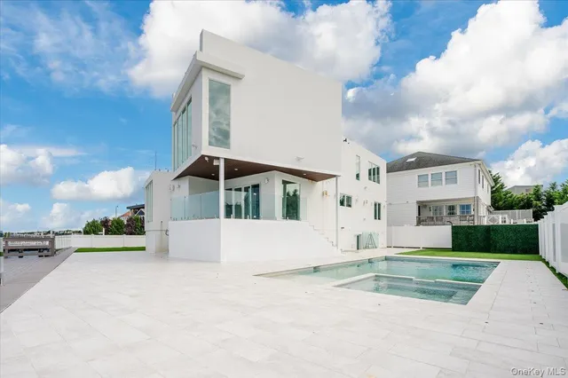 a view of a swimming pool with a patio
