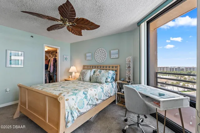 a bedroom with a bed and a table