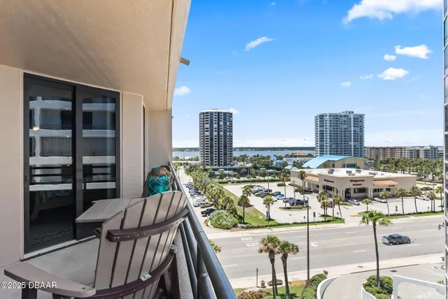 a view of a balcony with chairs