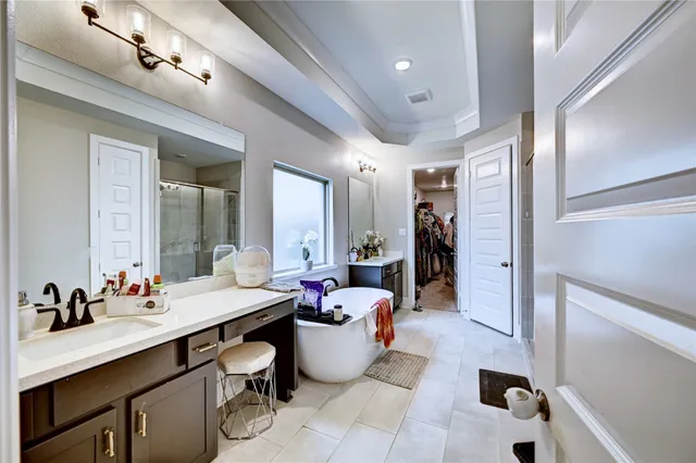 a bedroom with a bed couch and window