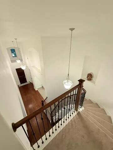a view of a hallway with stairs