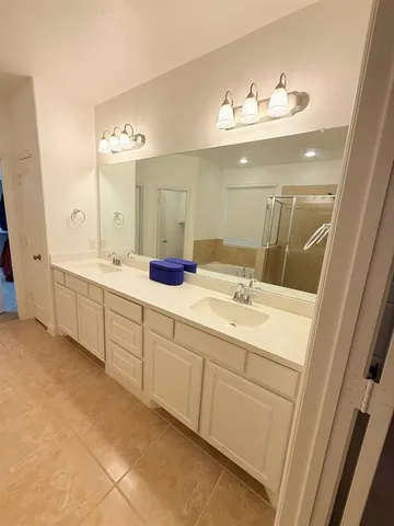 a kitchen with kitchen island granite countertop a stove and a sink