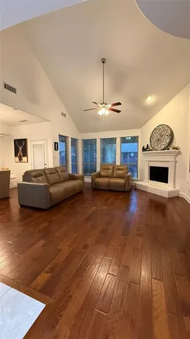 a kitchen with kitchen island granite countertop a sink appliances and cabinets