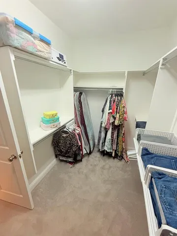 a view of a kitchen with a sink and cabinets