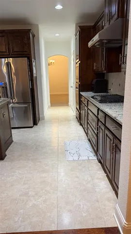 a view of a hallway with a living room