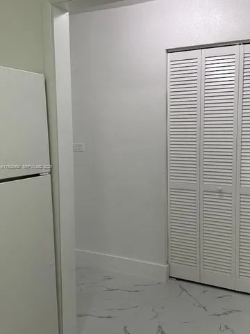 a view of a room that has a window in it