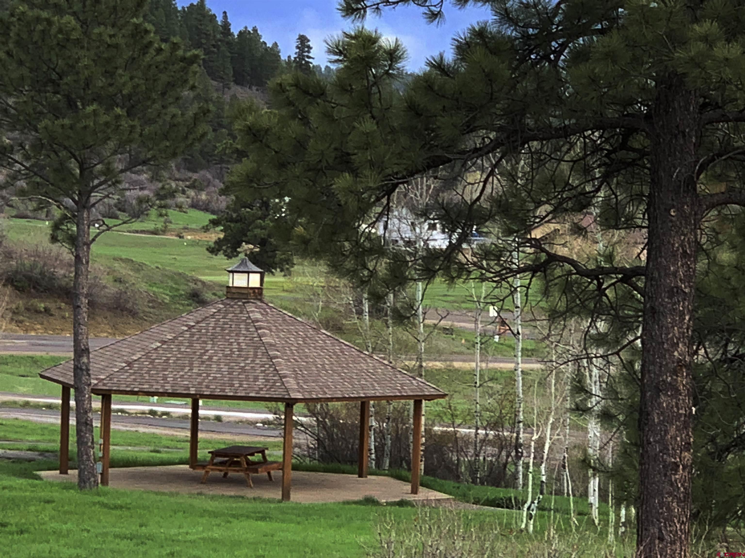 721 Clint Circle Pagosa Springs, CO 81147 - Photo 33 of 42 a view of house with backyard and outdoor seating