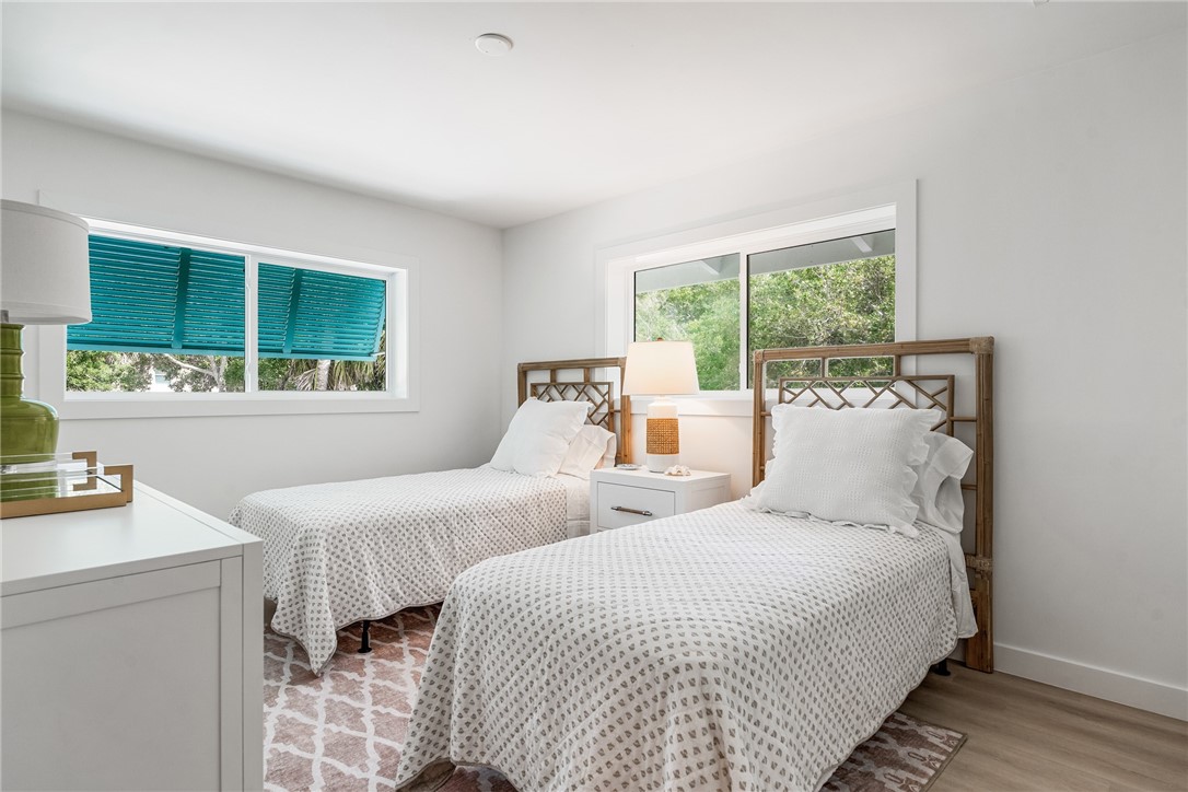 1881 Pebble Path Vero Beach, FL 32963 - Photo 24 of 34 a bedroom with two beds and a large window