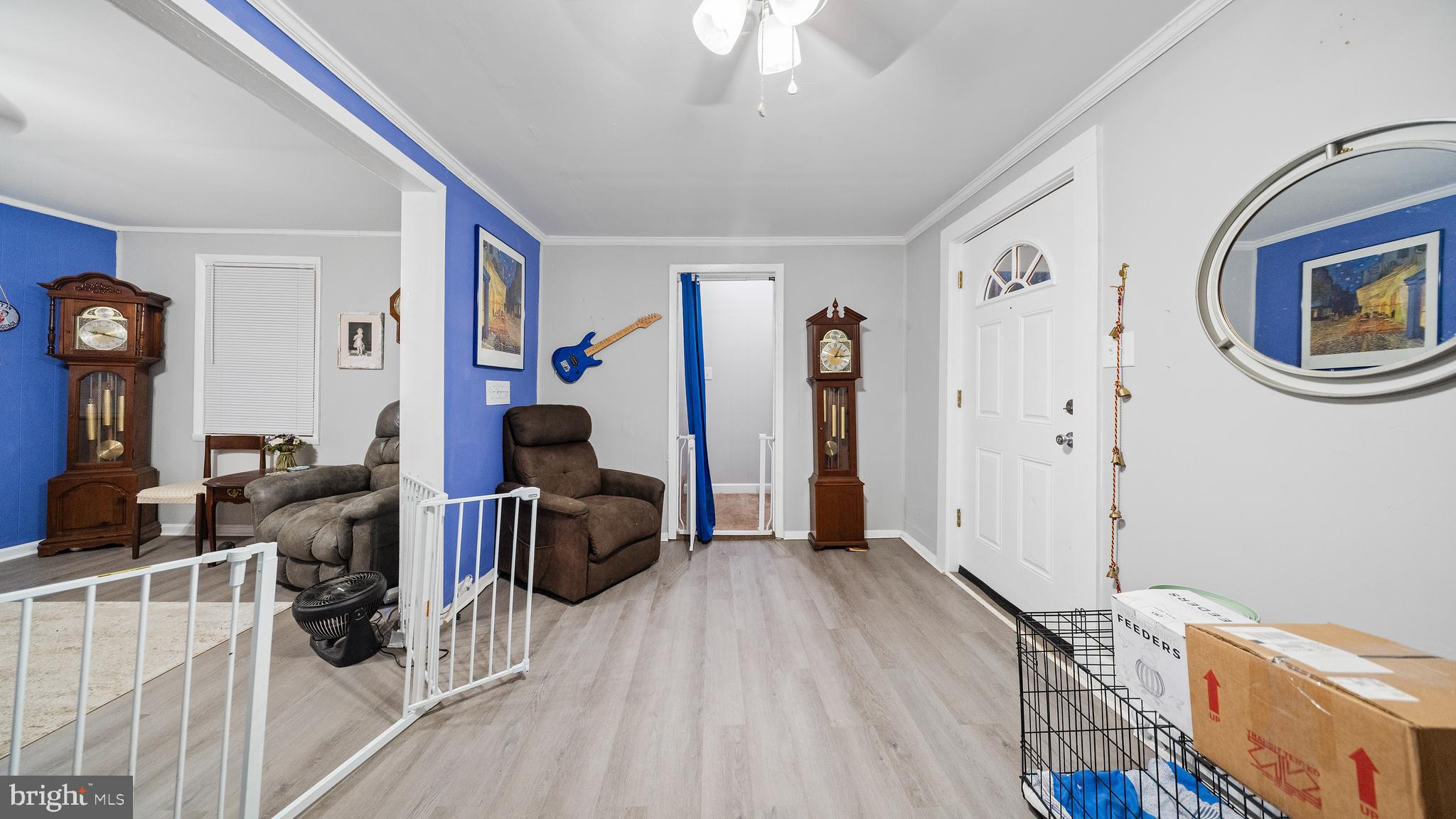 328 Pine Street Crisfield, MD 21817 - Photo 3 of 23 a room with furniture and wooden floor