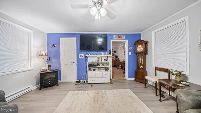 a view of a livingroom with furniture and workspace