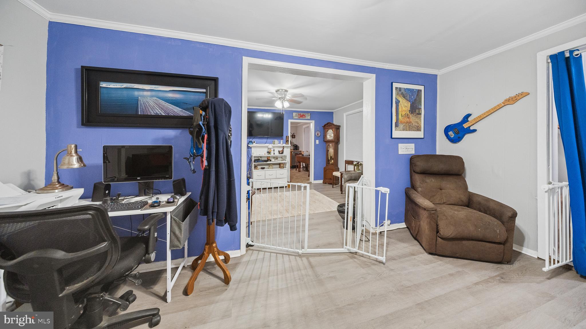328 Pine Street Crisfield, MD 21817 - Photo 5 of 23 a view of a livingroom with workspace and a couch