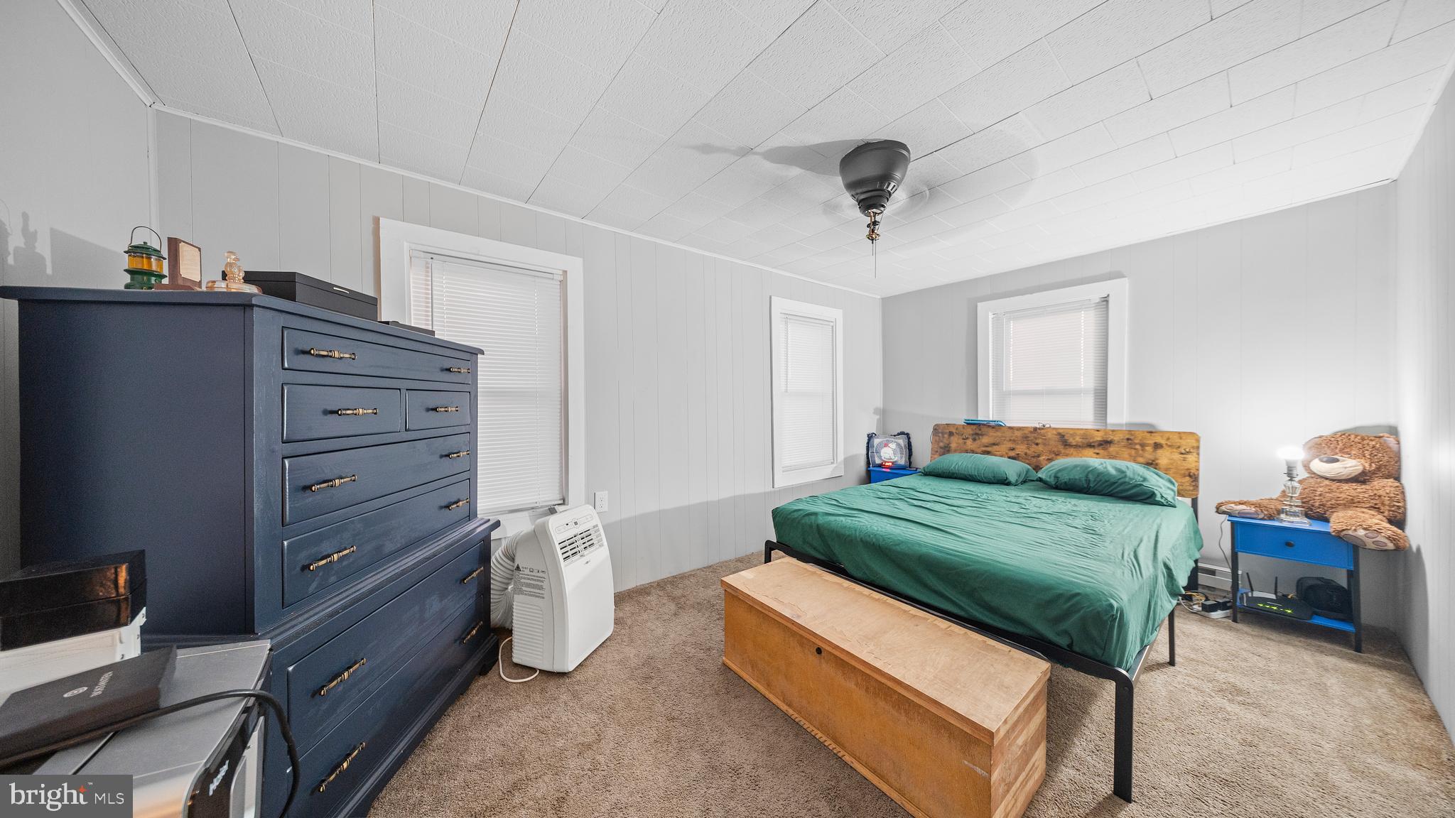 328 Pine Street Crisfield, MD 21817 - Photo 10 of 23 a bedroom with a bed and a dresser