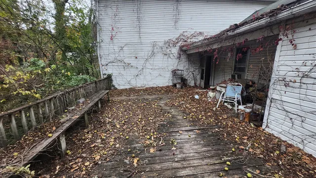 a view of a backyard with sitting area