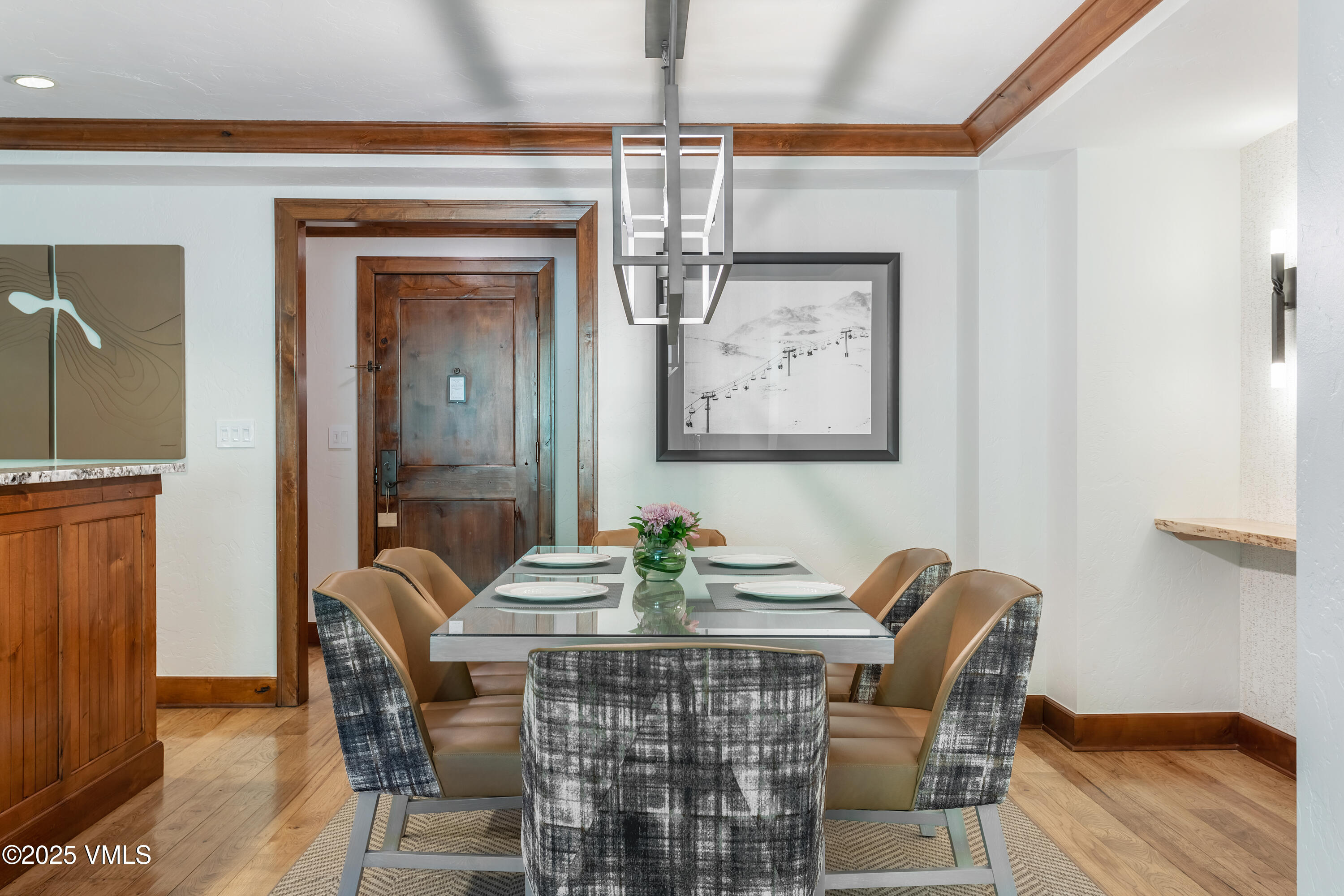 100 Bachelor Ridge Road, Unit 3414 Avon, CO 81620 - Photo 12 of 58 a view of a dining room with furniture wooden floor and a chandelier
