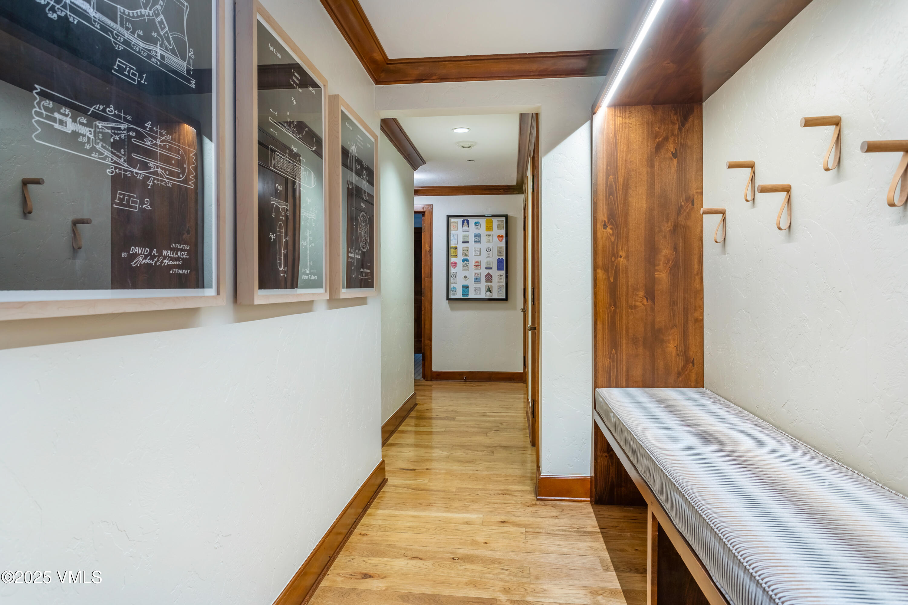 100 Bachelor Ridge Road, Unit 3414 Avon, CO 81620 - Photo 18 of 58 a view of a hallway with wooden floor and staircase