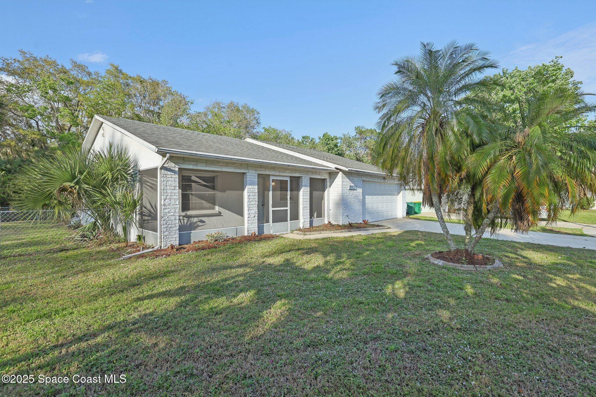 3837 Parapet Drive Cocoa, FL 32926 - Photo 1 of 42 a view of a house with a backyard