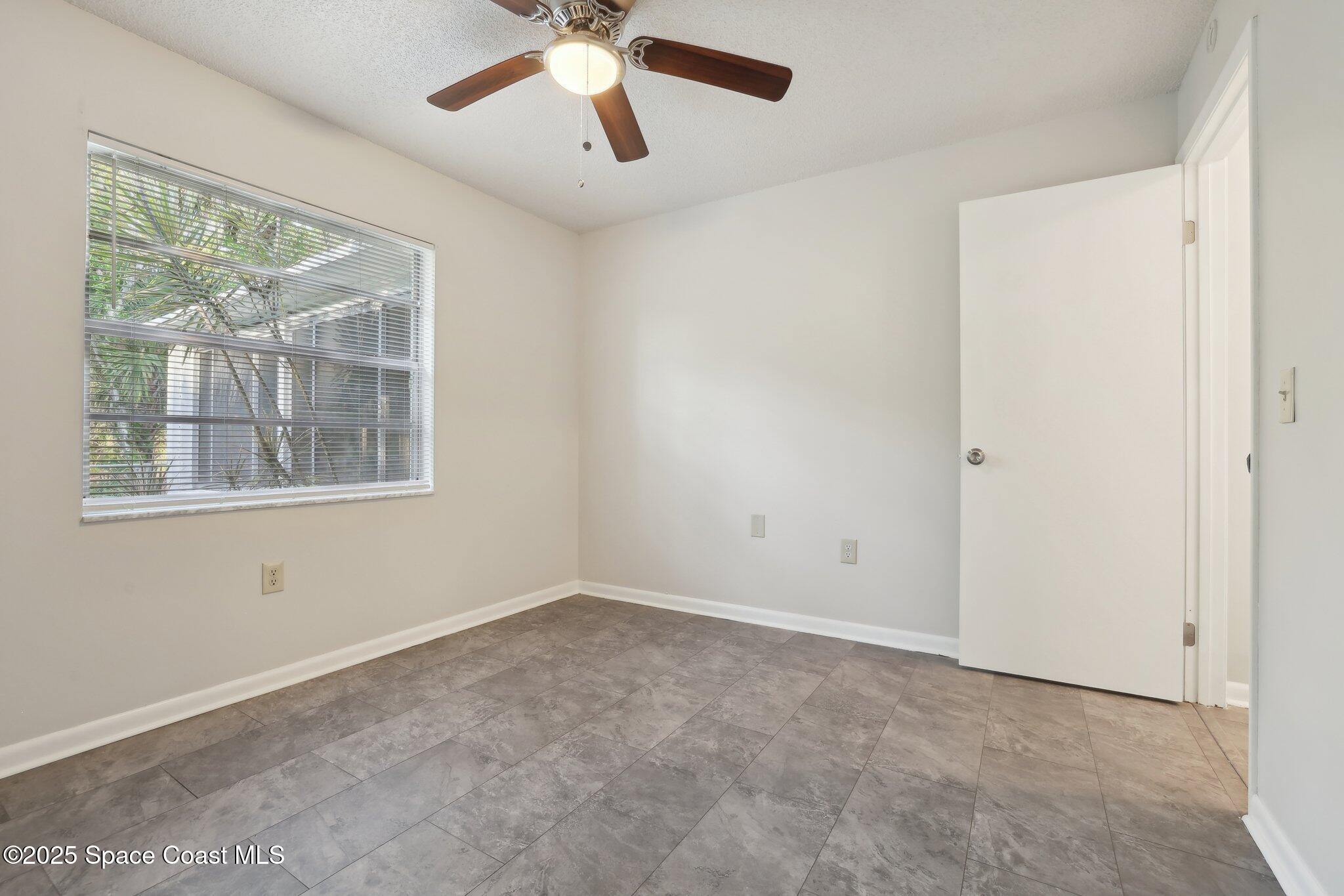 3837 Parapet Drive Cocoa, FL 32926 - Photo 25 of 42 a view of an empty room with a window