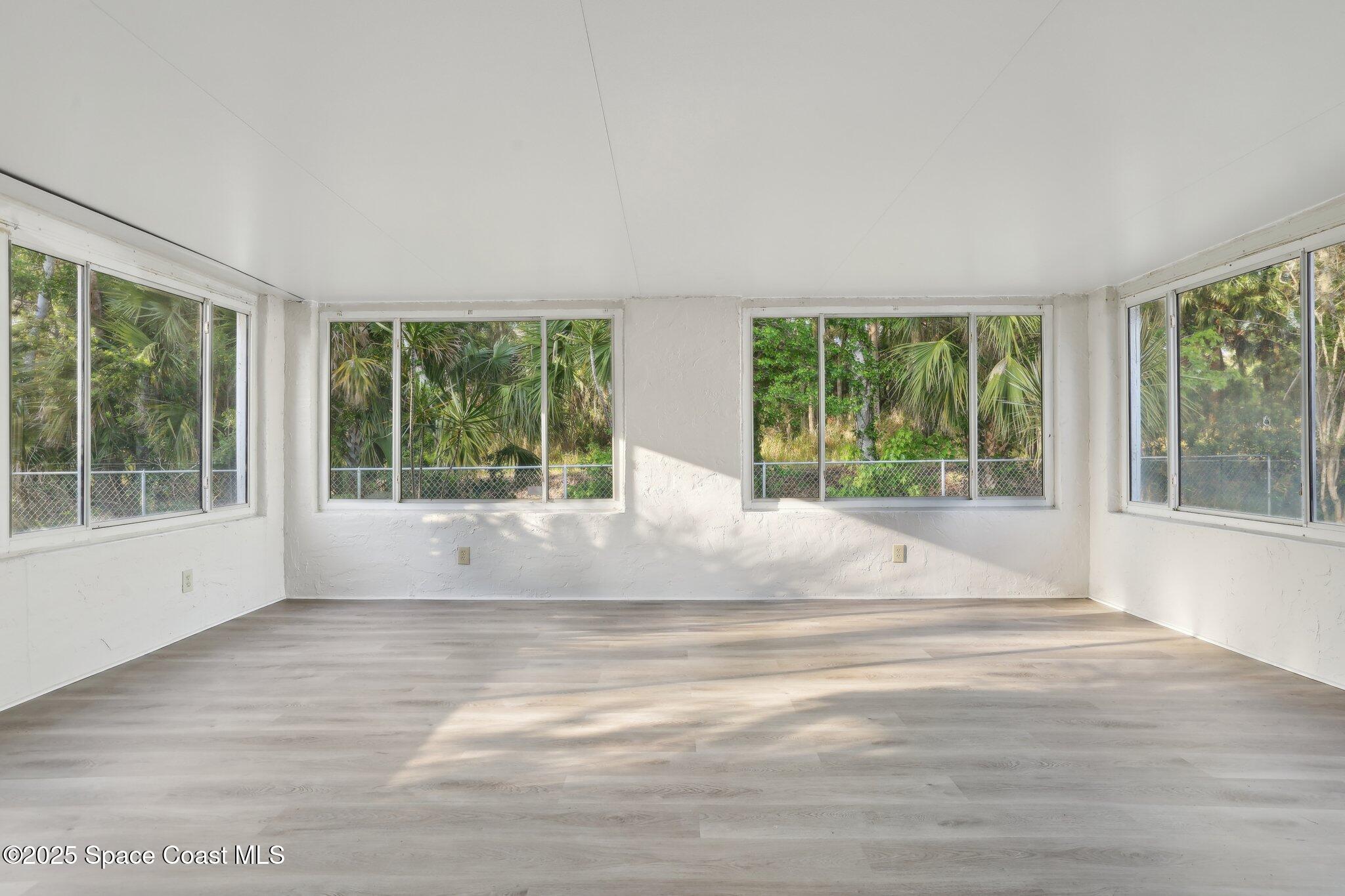 3837 Parapet Drive Cocoa, FL 32926 - Photo 33 of 42 a view of room with window and outdoor view