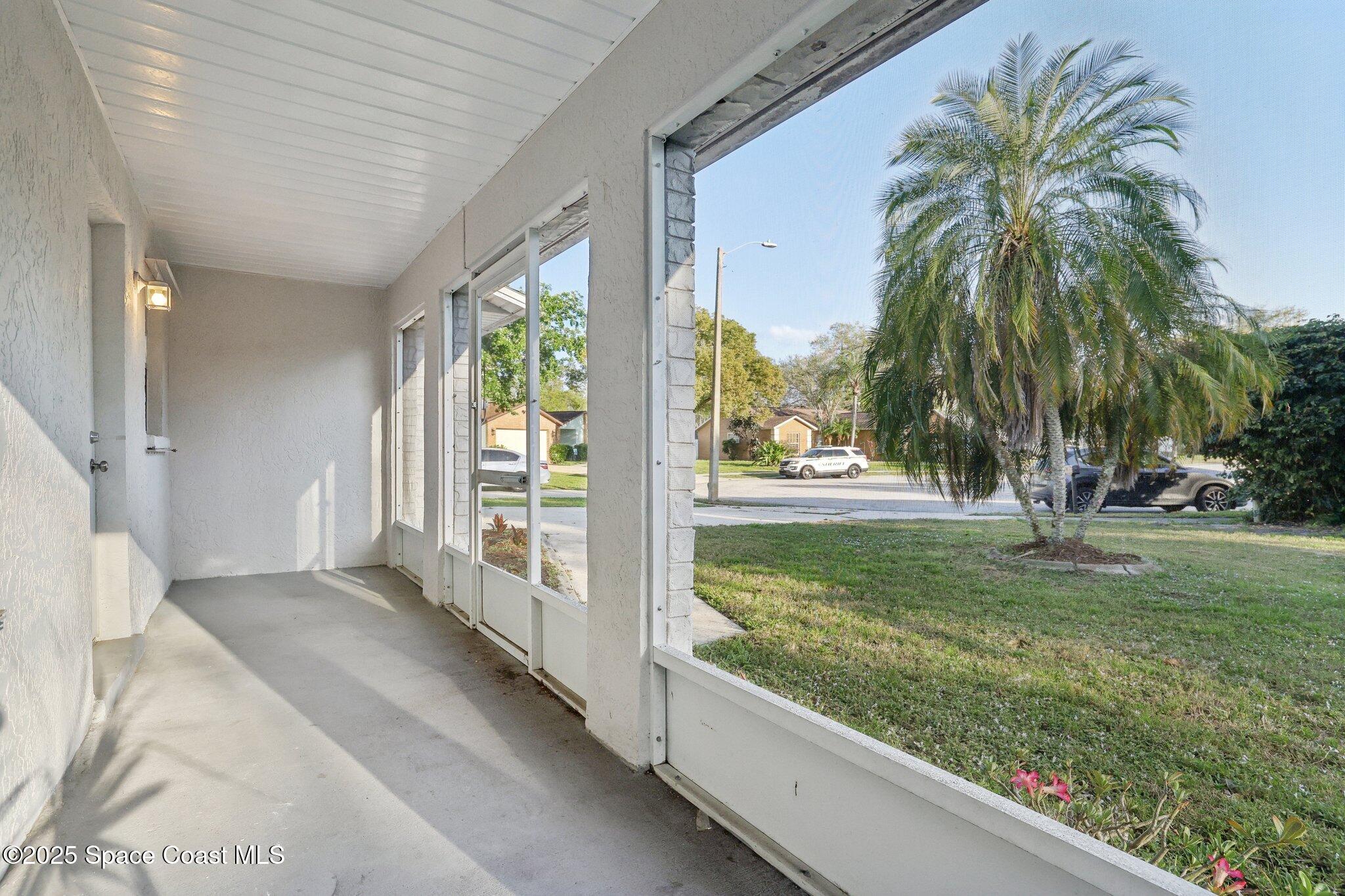 3837 Parapet Drive Cocoa, FL 32926 - Photo 6 of 42 a view of a porch and garden