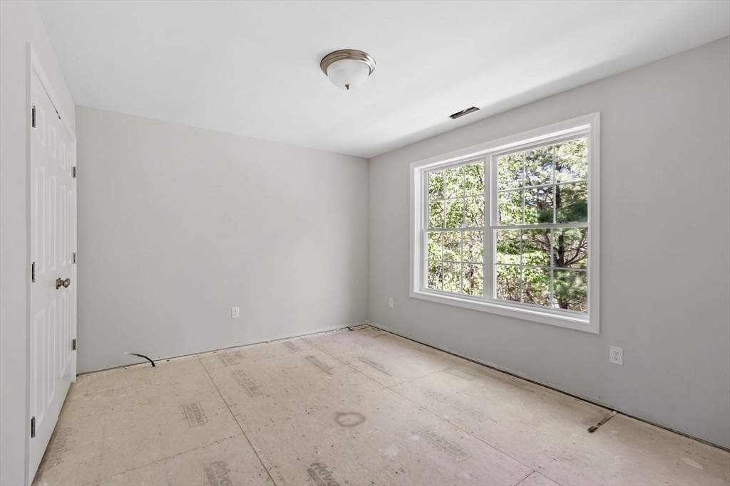 22 Benoit Avenue Pelham, NH 03076 - Photo 31 of 42 a view of an empty room with a window