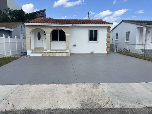 a front view of a house with garage