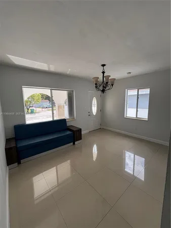 a view of empty room with windows