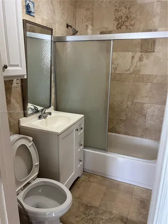 a utility room with a sink dryer and washer