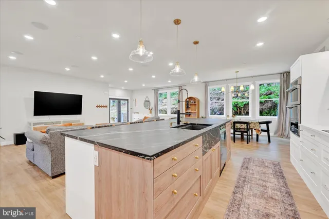a kitchen with a table and chairs in it