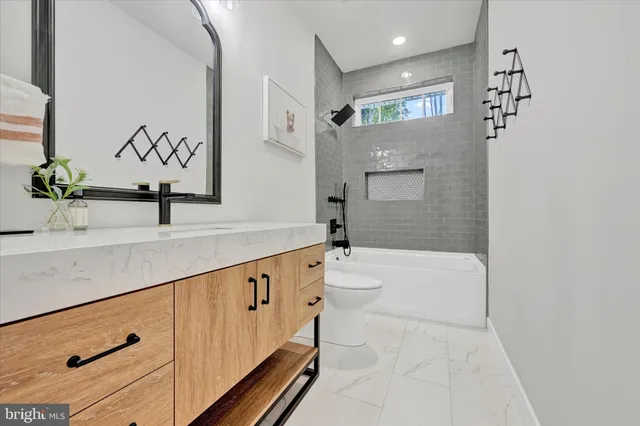 a bathroom with a bathtub and a sink
