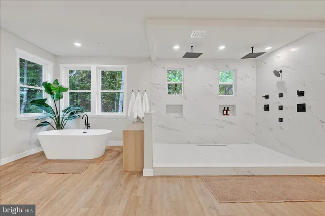 a bathroom with a bathtub and sink