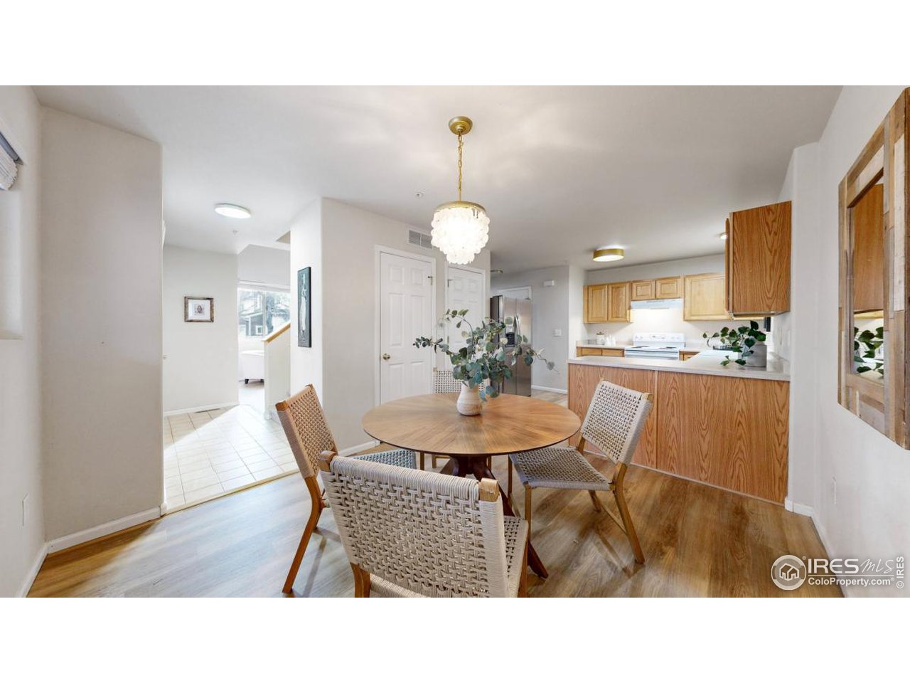 2621 Rigden Parkway, Unit 4 Fort Collins, CO 80525 - Photo 14 of 28 a dining room with furniture and wooden floor