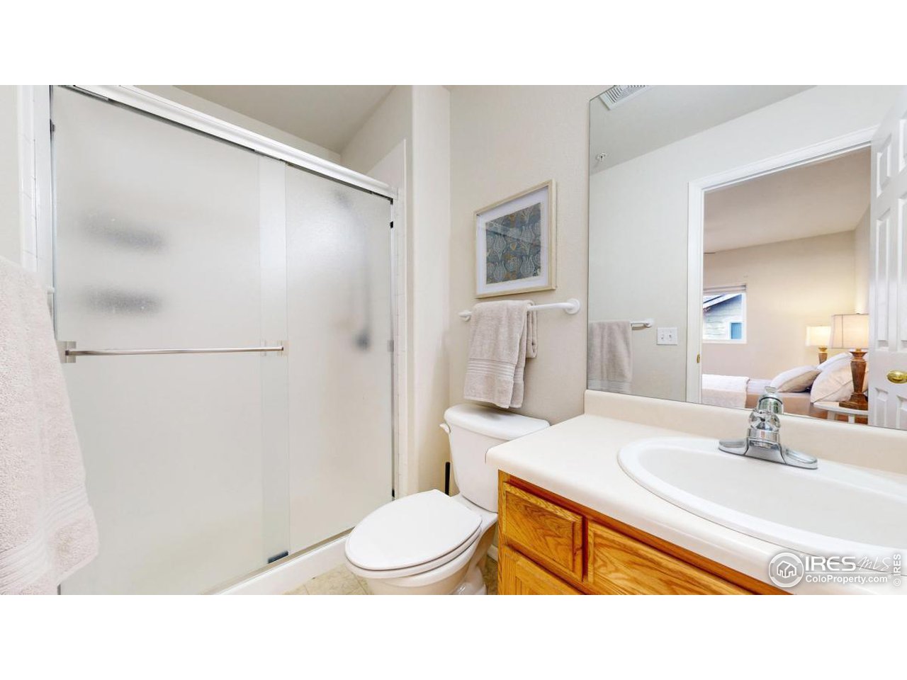 2621 Rigden Parkway, Unit 4 Fort Collins, CO 80525 - Photo 18 of 28 a bathroom with a sink toilet and shower