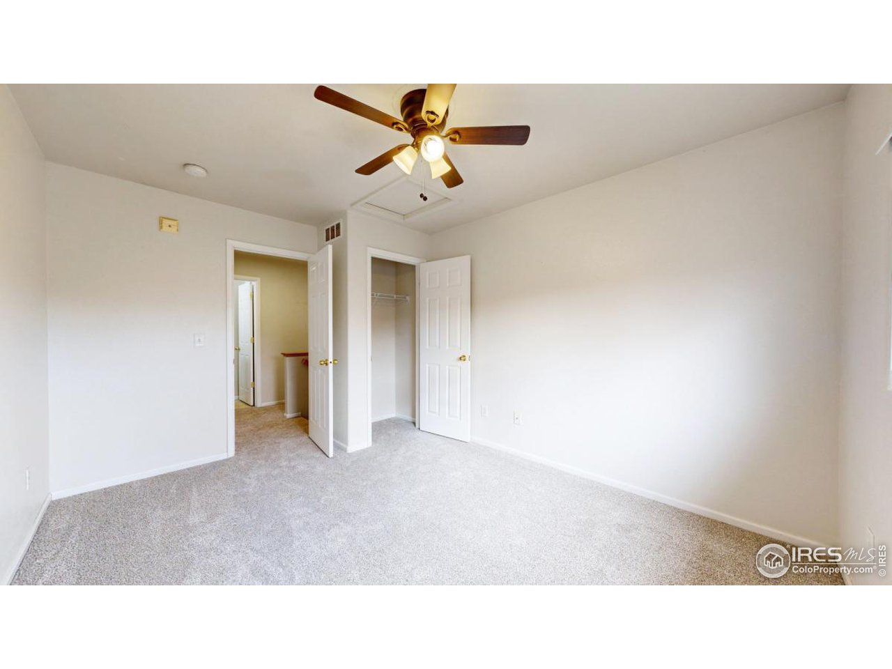 2621 Rigden Parkway, Unit 4 Fort Collins, CO 80525 - Photo 20 of 28 a open hall with a ceiling fan